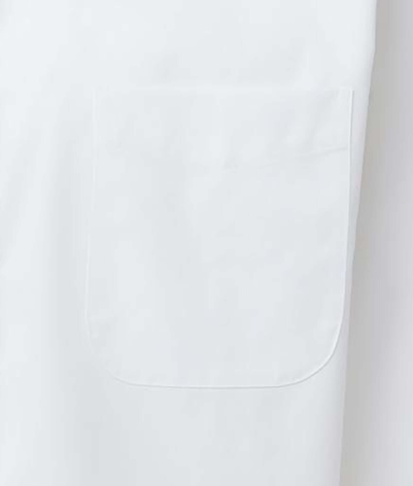 Close-up of a white shirt pocket showcasing its clean design and smooth fabric.
