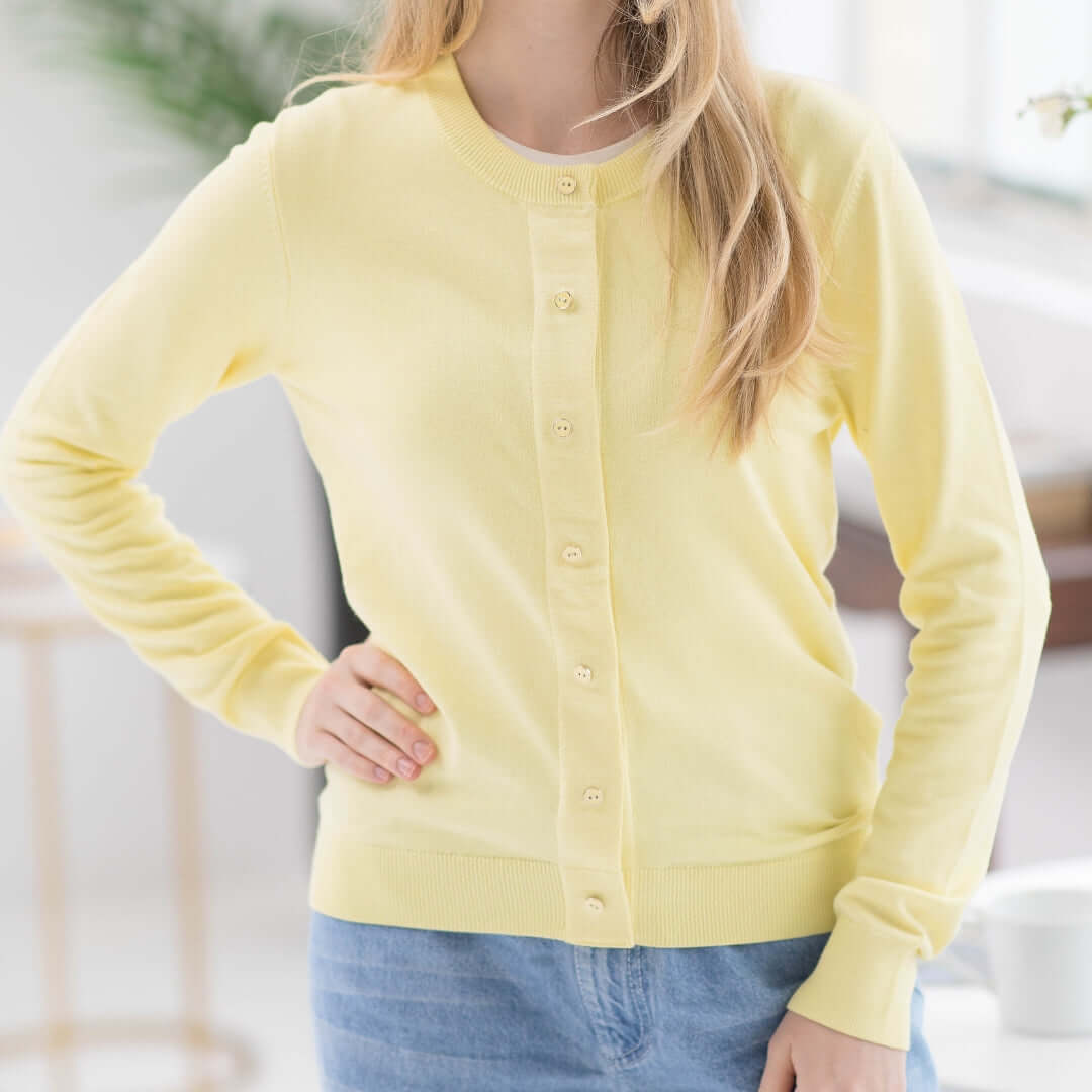 Women's adaptive yellow knit cardigan sweater with magnetic front for easy dressing.